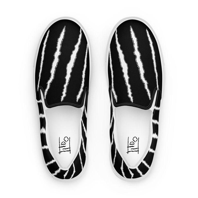 I let the dogs out slip-on black shoes with white scratch marks